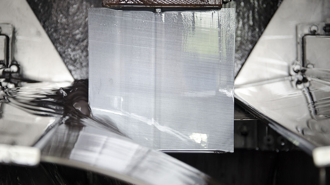 A silicon brick is sawn into thin slices