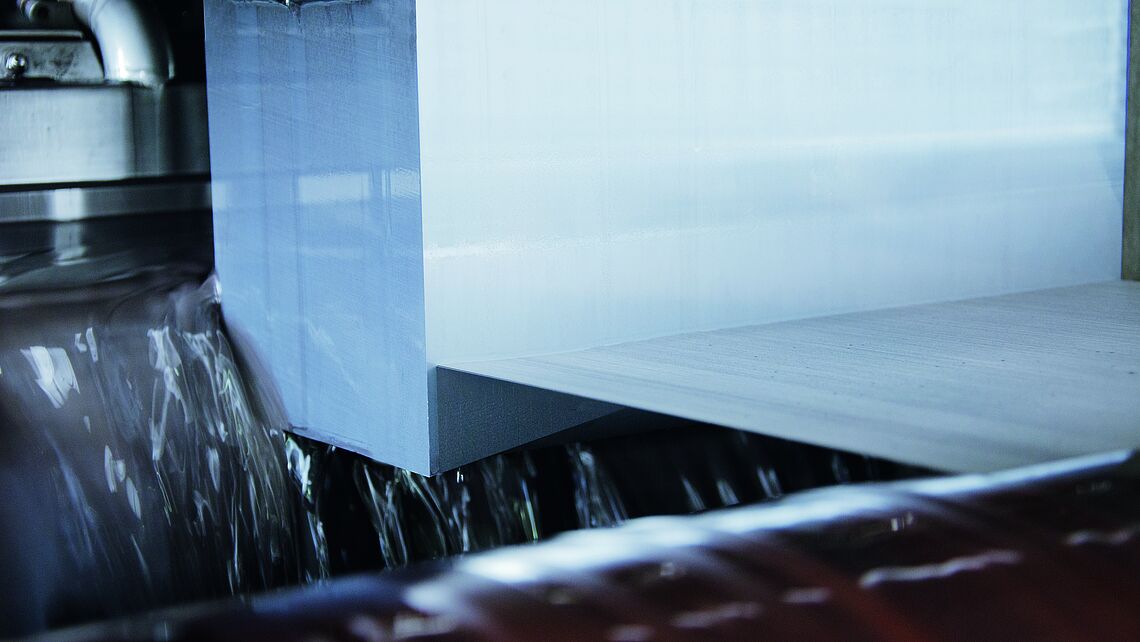 The diamond wire web cuts through a block of silicon